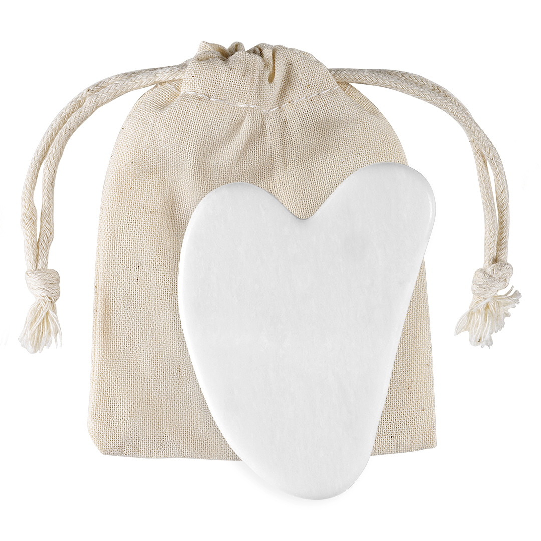 Gua sha stone in a pouch